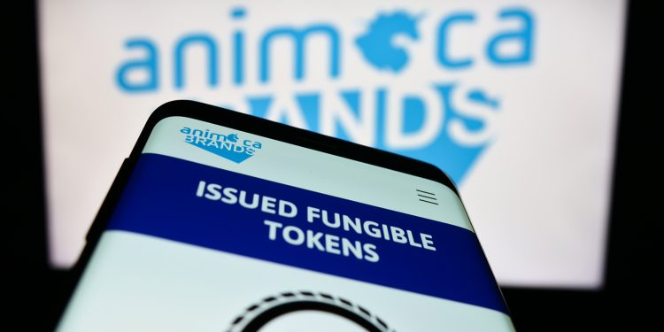 Animoca Brands Acquires Somo as NFT Market Rebounds in Early 2026缩略图 Mobile phone with webpage of software company Animoca Brands Corporation Ltd. on screen in front of logo. Focus on top-left of phone display.