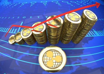 Ripple graph, digital currency rising in market value - symbolized by a gold coin and blue digital background.