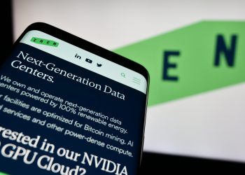 Smartphone with website of Australian Bitcoin mining company Iris Energy Ltd. (IREN) in front of logo. Focus on top-left of phone display.
