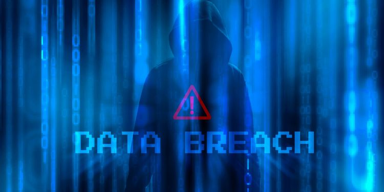 Ransomware concept. Abstract digital background with anonymous man of hacker in binary code and wording DATA BREACH with warning sign. Hack and science fiction. Matrix background with cybersecurity